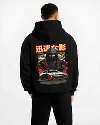 Black hoodie worn by a male model, back view, featuring Nissan SKYLINE r34 ninja drift jdm japanese street speed graphic.