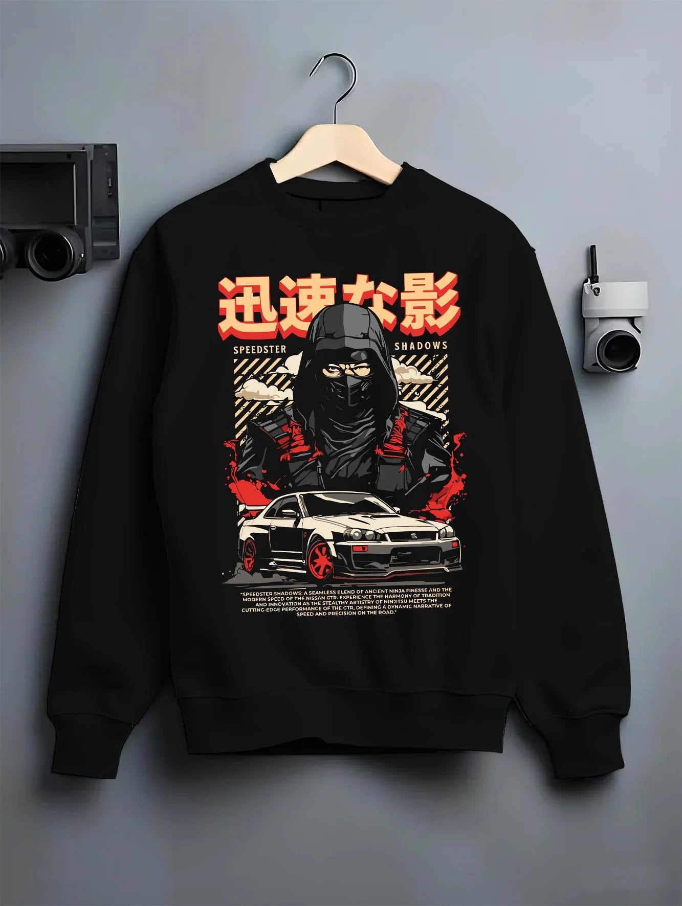 Black crewneck sweatshirt on a hanger against a grey wall, featuring Nissan SKYLINE r34 ninja drift jdm japanese street graphic.