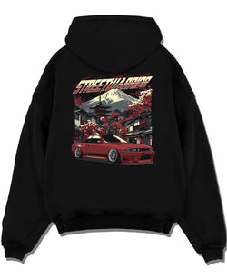 Black pullover hoodie laid flat on a white background, featuring SKYLINE r32 drift jdm street retro racing performance graphic.