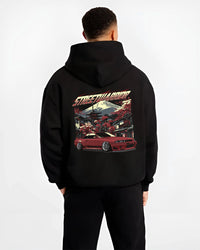 Black hoodie worn by a male model, back view, featuring SKYLINE r32 drift jdm street retro racing performance graphic.