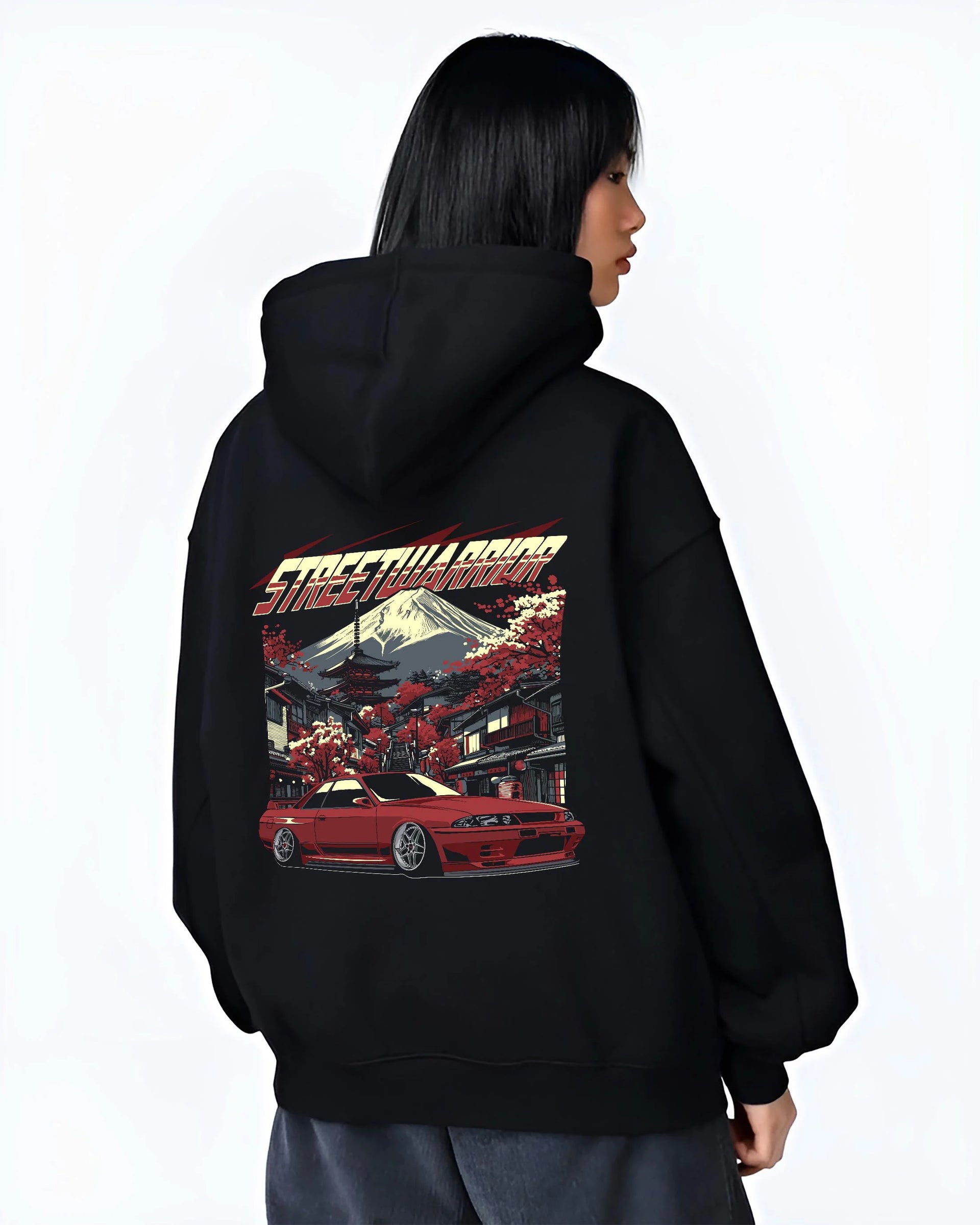 Black hoodie worn by a female model, back view, featuring SKYLINE r32 drift jdm street retro racing performance graphic.