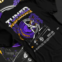 Black T-shirt laid flat with natural fabric folds, featuring Subaru WRX rally legend racing street performance motorsport graphic.