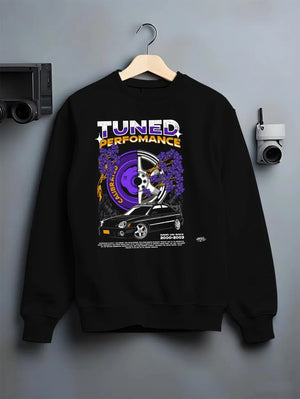Black crewneck sweatshirt on a hanger against a grey wall, featuring Subaru WRX rally legend racing street performance graphic.