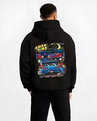 Black hoodie worn by a male model, back view, featuring Nissan Skyline R34 r34 skyline racing drift jdm tuner street graphic.