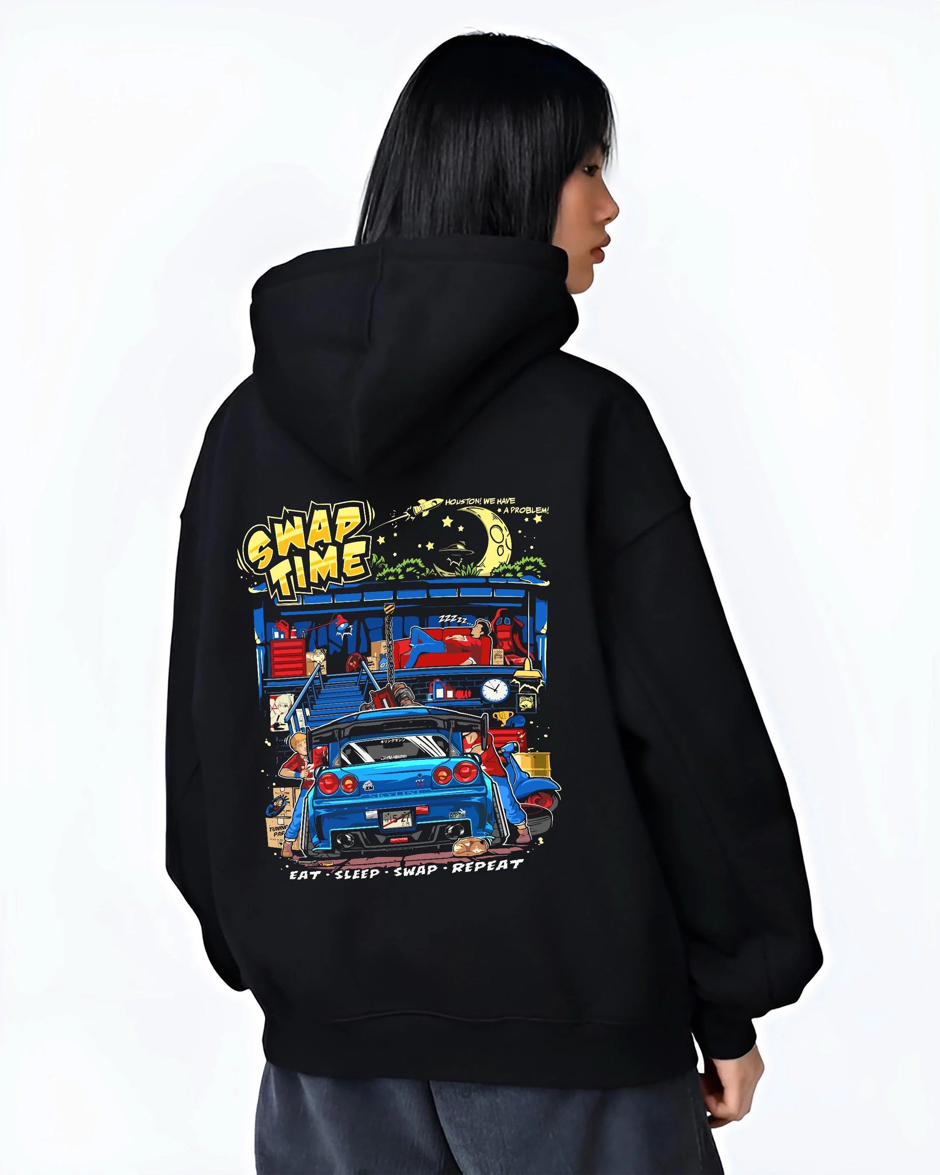 Black hoodie worn by a female model, back view, featuring Nissan Skyline R34 r34 skyline racing drift jdm tuner street graphic.