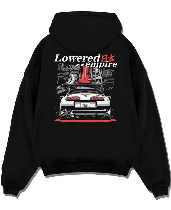 Black pullover hoodie laid flat on a white background, featuring Toyota Supra turbo drift jdm lowered power racing graphic.