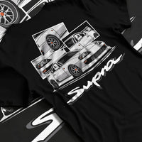 Black T-shirt laid flat with natural fabric folds, featuring Toyota Supra turbo turbocharged jdm street classic racing graphic.