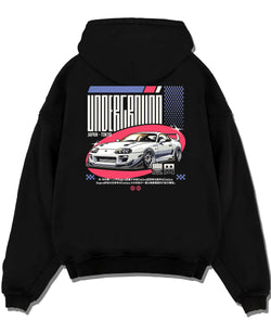 Black pullover hoodie laid flat on a white background, featuring Toyota Supra drift tokyo underground tokyo drift racing graphic.