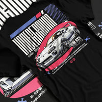 Black T-shirt laid flat with natural fabric folds, featuring Toyota Supra drift tokyo underground tokyo drift racing street graphic.