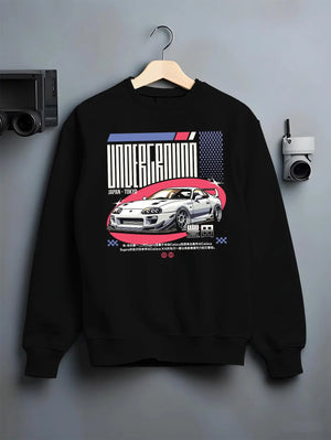 Black crewneck sweatshirt on a hanger against a grey wall, featuring Toyota Supra drift tokyo underground tokyo drift graphic.