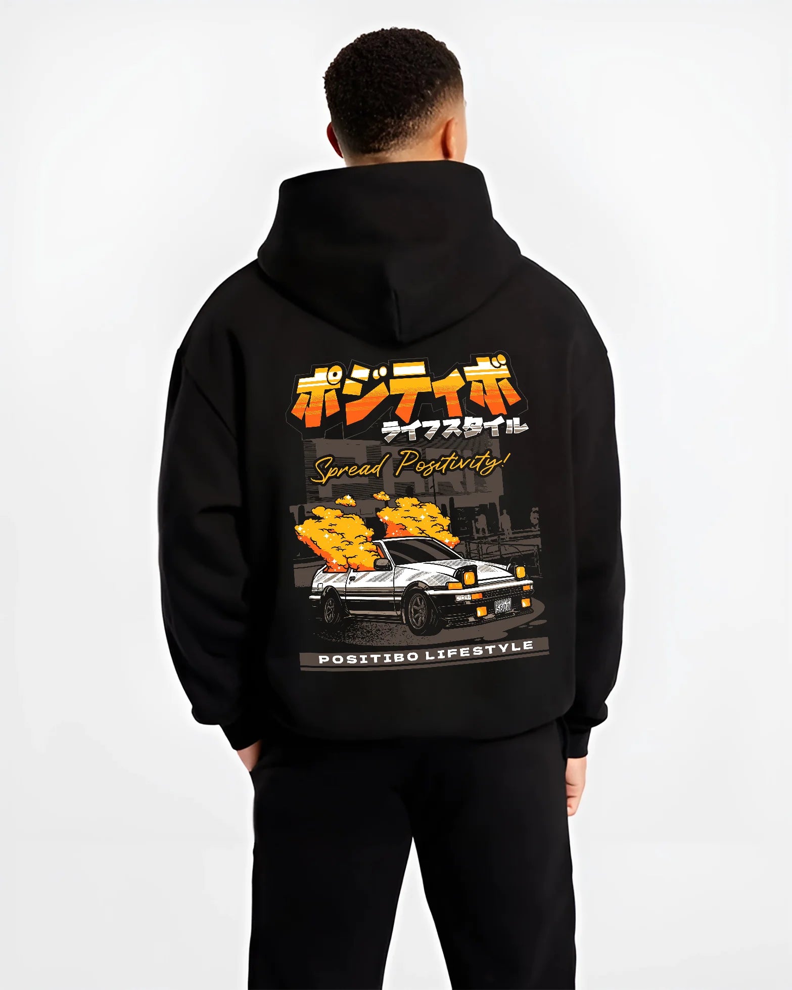 Black hoodie worn by a male model, back view, featuring Toyota AE86 drift jdm racing street performance motorsport graphic.