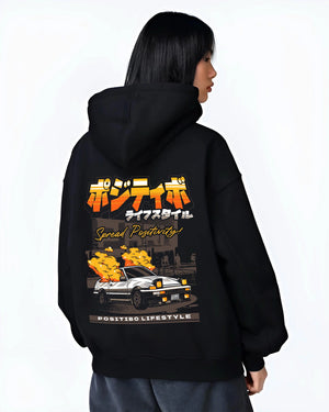 Black hoodie worn by a female model, back view, featuring Toyota AE86 drift jdm racing street performance motorsport graphic.