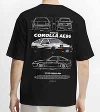 Black T-shirt worn by a male model, back view, featuring Toyota AE86 drift legend racing street performance motorsport graphic.