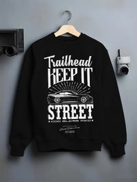 Black crewneck sweatshirt on a hanger against a grey wall, featuring rs racing race street enthusiast performance graphic.