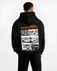 Black hoodie worn by a male model, back view, featuring Toyota Supra rs racing jdm tuner street vintage enthusiast graphic.