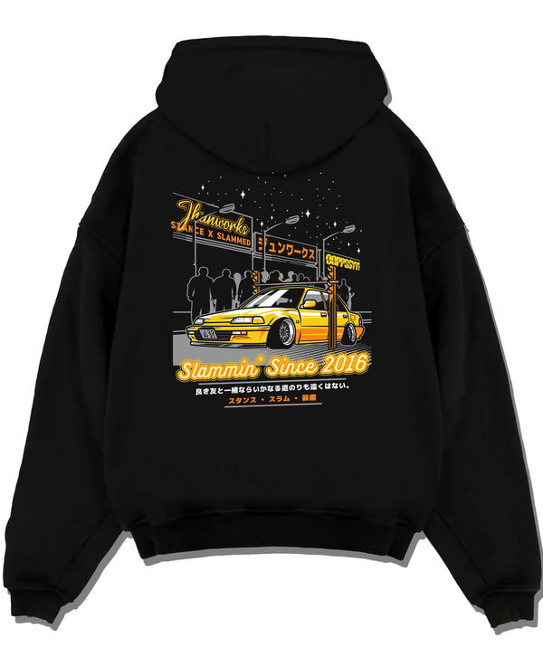 Black pullover hoodie laid flat on a white background, featuring Honda rs type r racing motorsport jdm street performance graphic.