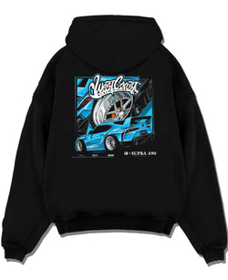 Black pullover hoodie laid flat on a white background, featuring Toyota Supra racing jdm tuning street enthusiast graphic.