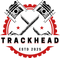 Black and red Trackhead logo featuring crossed pistons and gear emblem, symbolizing JDM car culture and racing spirit.