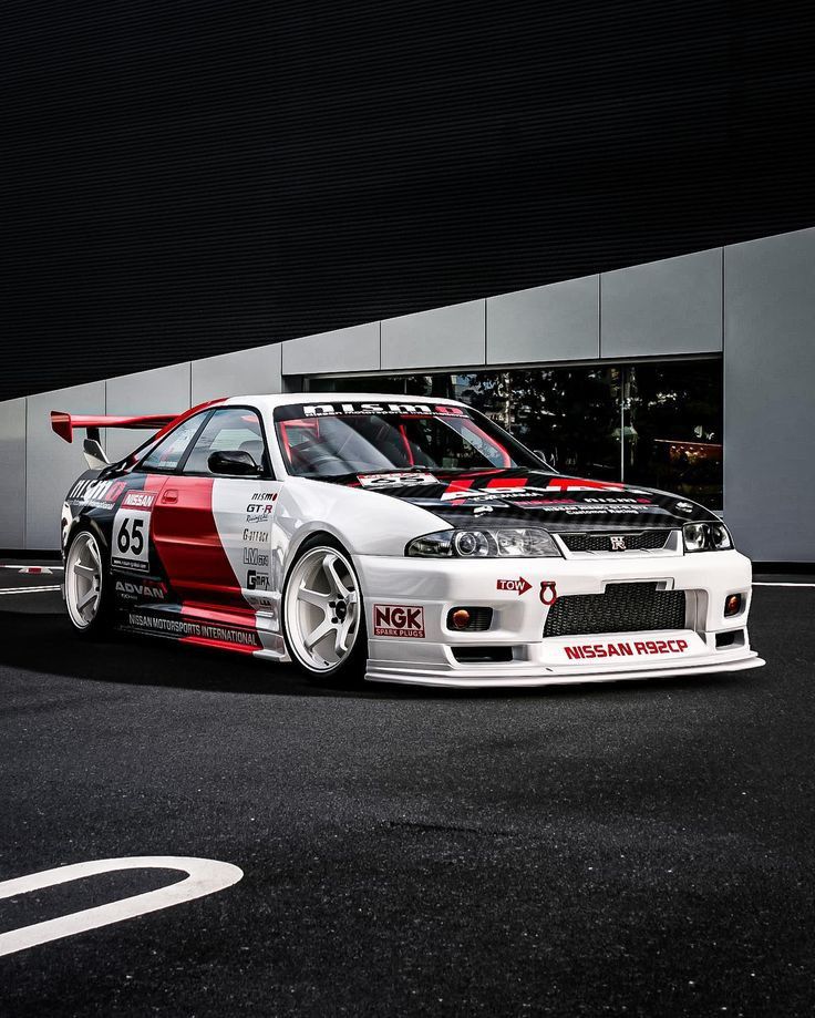 Trackhead JDM race car – Nissan Skyline R33 with widebody kit, rear wing, and track-inspired livery – performance street racing aesthetic