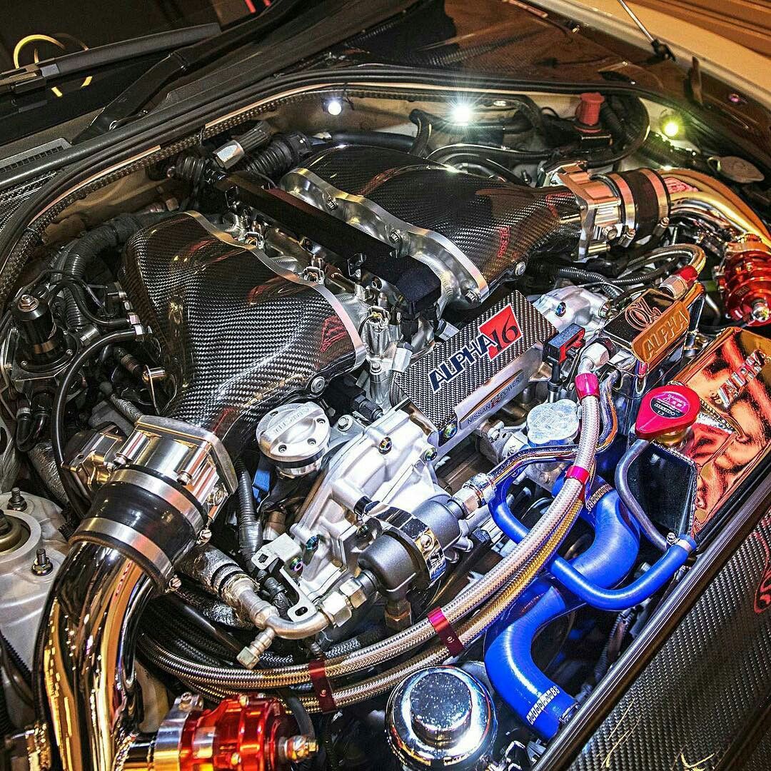 Trackhead JDM turbo engine bay with polished piping, carbon intakes, and performance car tuning culture
