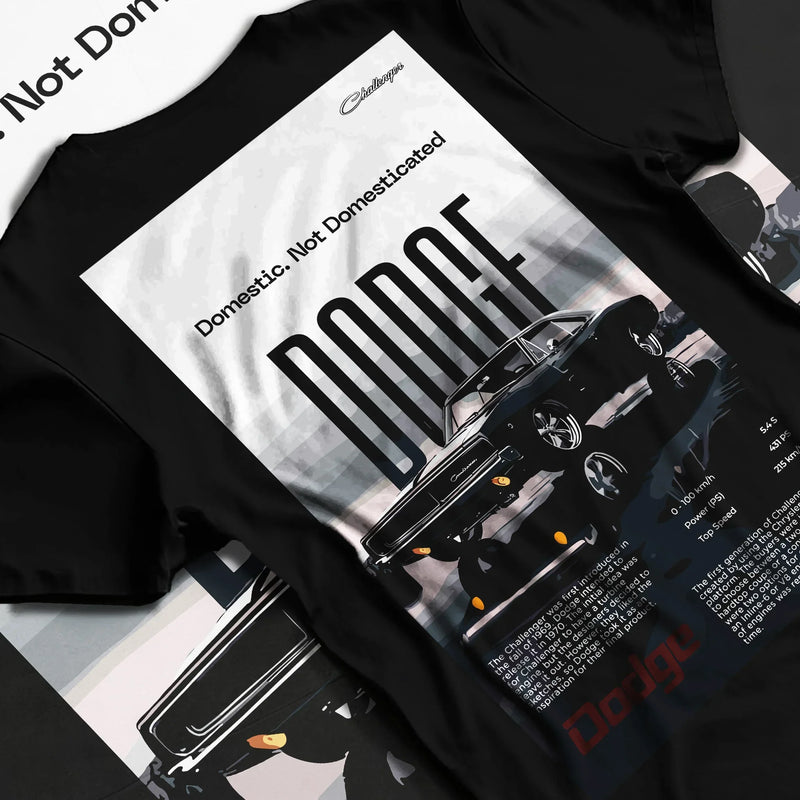 Black T-shirt featuring classic Dodge Challenger graphic with Domestic Not Domesticated slogan in bold American muscle streetwear design.