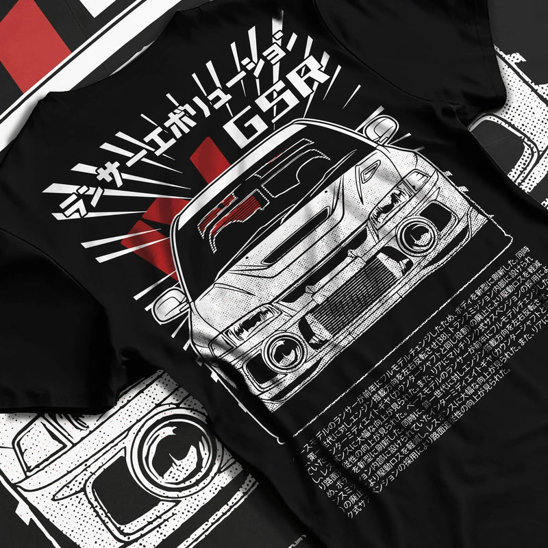Black T-shirt featuring Mitsubishi Evo JDM graphic in bold tuner streetwear design with Japanese text and rally-inspired artwork.