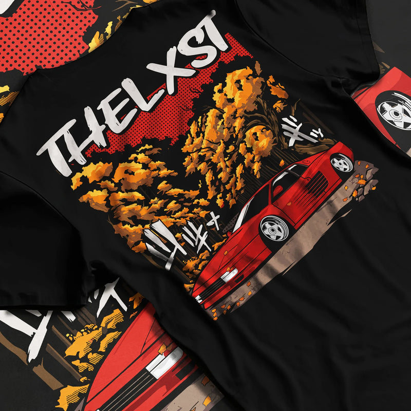 Black T-shirt featuring red Ferrari supercar graphic in bold JDM-inspired streetwear design with autumn drift scene artwork.