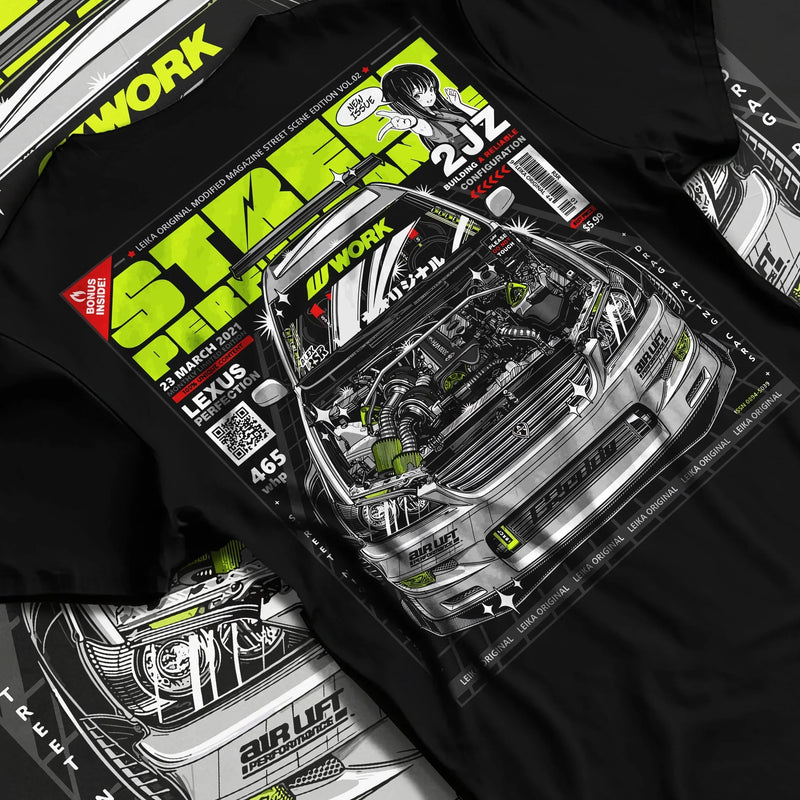 Black T-shirt featuring Lexus 2JZ tuner magazine-style drift graphic in bold JDM streetwear design with engine bay artwork.