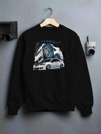 Black crewneck sweatshirt on a hanger against a grey wall, featuring ACURA jdm tuning stance slammed bagged street graphic.