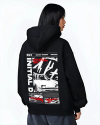 Black hoodie worn by a female model, back view, featuring Toyota AE86 racing drift jdm tuner initial d street graphic.