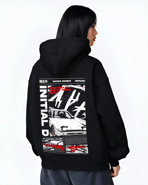 Black hoodie worn by a female model, back view, featuring Toyota AE86 racing drift jdm tuner initial d street graphic.
