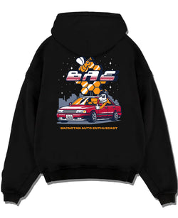 Black pullover hoodie laid flat on a white background, featuring street retro enthusiast racing performance motorsport graphic.