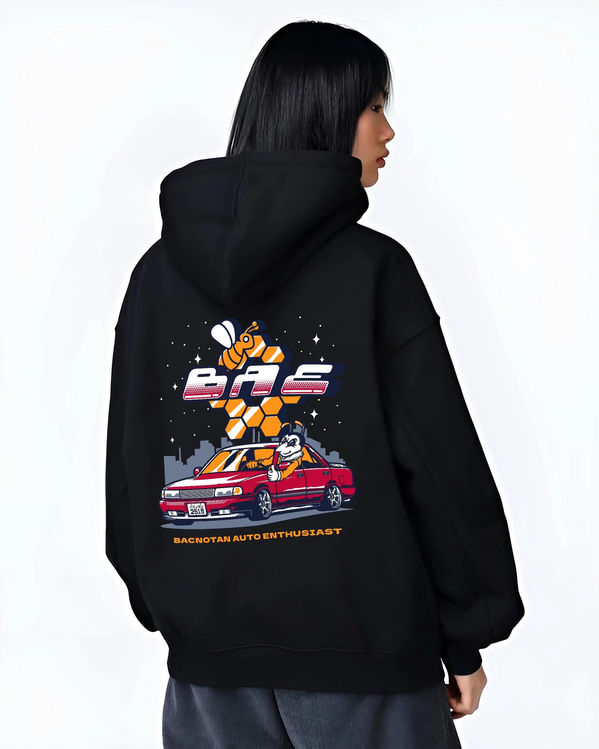 Black hoodie worn by a female model, back view, featuring street retro enthusiast racing performance motorsport automotive graphic.