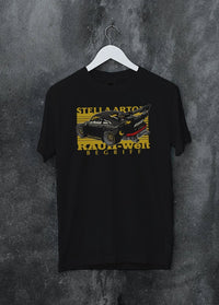 Black crewneck T-shirt on a hanger against a grey wall, featuring Porsche 911 rs racing jdm stance widebody rwb street graphic.