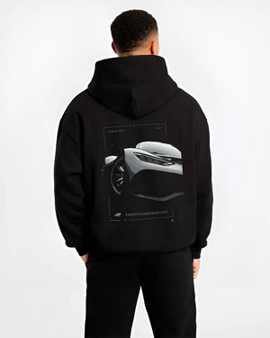 Black hoodie worn by a male model, back view, featuring Mercedes-Benz AMG rs racing motorsport street performance graphic.