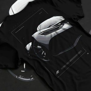 Black T-shirt laid flat with natural fabric folds, featuring Mercedes-Benz AMG rs racing motorsport street performance graphic.