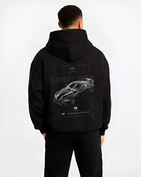 Black hoodie worn by a male model, back view, featuring Aston Martin Vantage gt3 rs racing motorsport street performance graphic.
