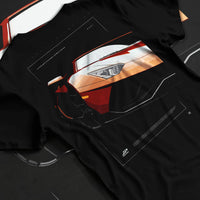 Black T-shirt laid flat with natural fabric folds, featuring Lamborghini Aventador racing street performance motorsport graphic.