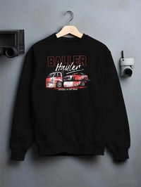 Black crewneck sweatshirt on a hanger against a grey wall, featuring racing drift japanese tuner street performance graphic.
