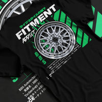 Black T-shirt laid flat with natural fabric folds, featuring racing jdm stance street performance motorsport automotive graphic.