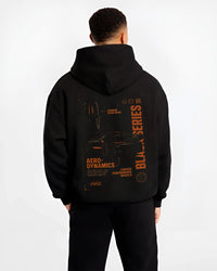 Black hoodie worn by a male model, back view, featuring Mercedes-Benz AMG rs racing motorsport street performance blkamg.