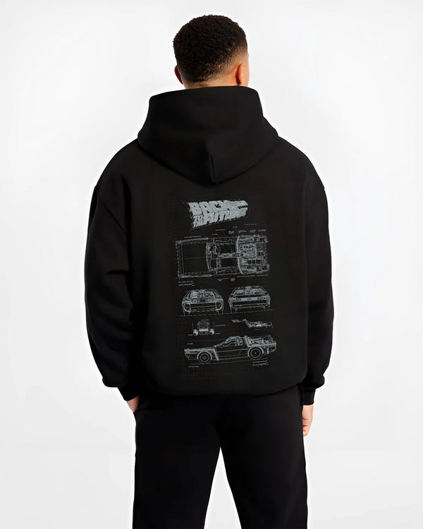 Black hoodie worn by a male model, back view, featuring DeLorean DMC-12 street retro racing performance motorsport graphic.