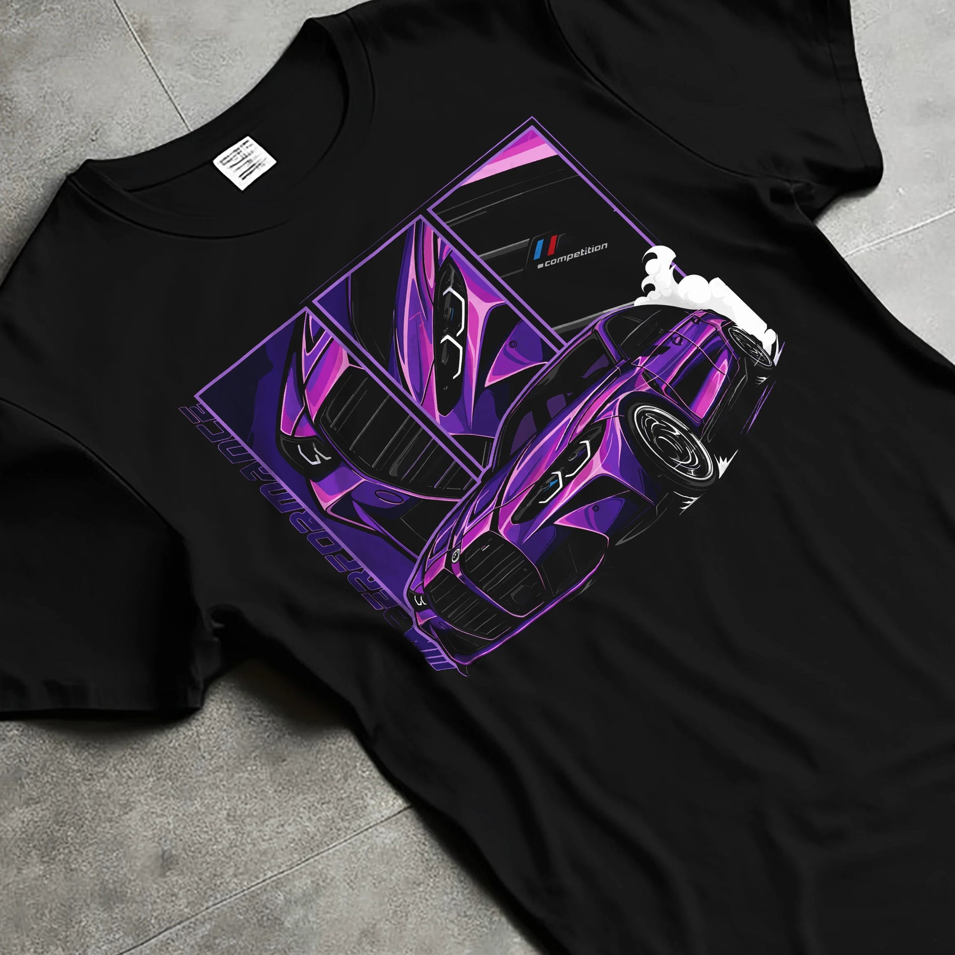 Black T-shirt laid flat with natural fabric folds, featuring BMW M4 turbo drift racing street performance motorsport graphic.