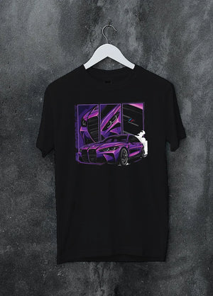Black crewneck T-shirt on a hanger against a grey wall, featuring BMW M4 turbo drift racing street performance motorsport graphic.