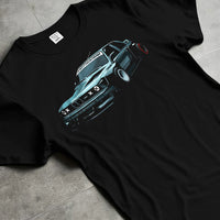 Black T-shirt laid flat with natural fabric folds, featuring BMW E30 rs drift jdm stance widebody racing graphic.