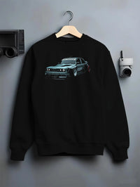 Black crewneck sweatshirt on a hanger against a grey wall, featuring BMW E30 rs drift jdm stance widebody racing graphic.