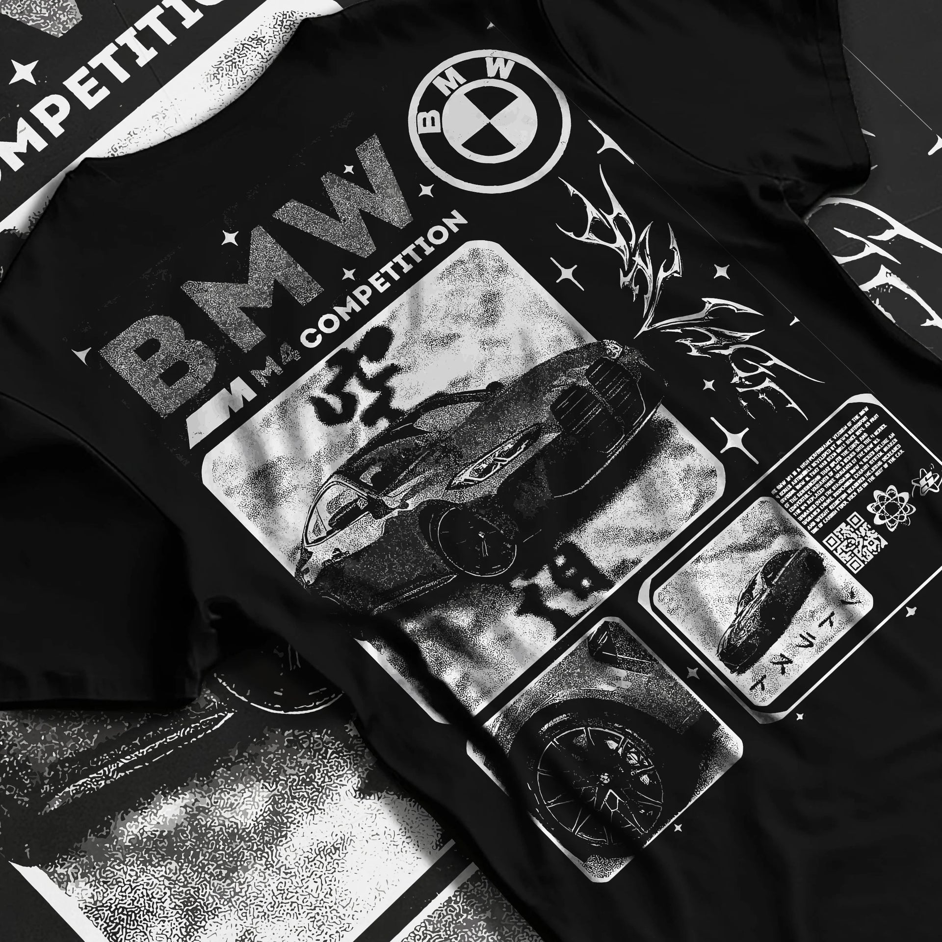 Black T-shirt laid flat with natural fabric folds, featuring BMW M4 german racing street performance motorsport automotive graphic.