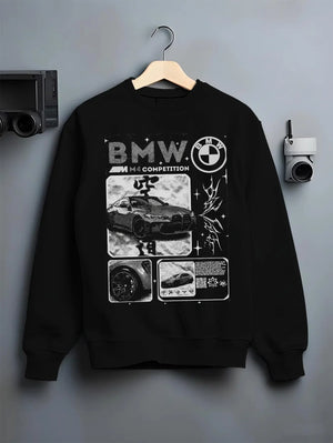 Black crewneck sweatshirt on a hanger against a grey wall, featuring BMW M4 german racing street performance motorsport graphic.
