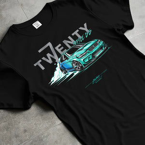 Black T-shirt laid flat with natural fabric folds, featuring BMW turbo drift racing street performance motorsport graphic.
