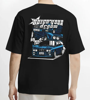 Black T-shirt worn by a male model, back view, featuring BMW E30 jdm japanese retro classic enthusiast racing graphic.